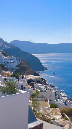 a view of the ocean and mountains from a rooftop top restaurant in mykonos, greece