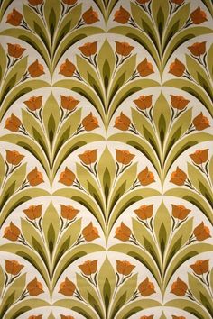 an art deco wallpaper with orange flowers and leaves