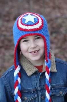 a young boy wearing a knitted captain america hat