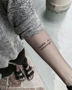 a woman's arm with a tattoo that reads, i love you to the moon and back