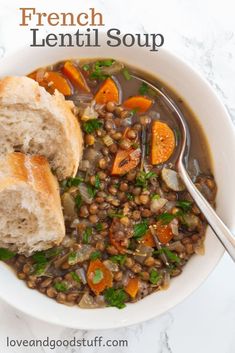 a white bowl filled with lentil soup and bread