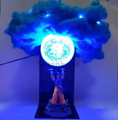 a statue is shown with blue light coming from it's head and hands in the air