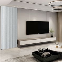 a living room with a large flat screen tv mounted on the wall next to a coffee table