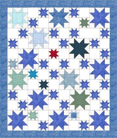 a blue and white quilt with many stars on the front, along with one red star