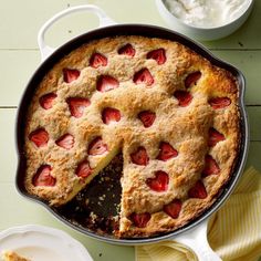 a strawberry pie with one slice missing from it