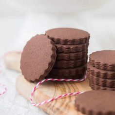 chocolate cookies on a wooden board with twine