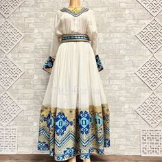 Beautiful Ethiopian and Eritrean Habeshan Dress. Stylish Menen, 100% Cotton We recommend hand washing and air drying to make it last longer. A low heating iron will also keep design and look. Cotton Ethiopian Wedding Dress, Eritrean Dress, Beautiful Ethiopian, Ethiopian Clothing, Habesha Dress, Ethiopian Traditional Dress, Ethiopian Women, Ethiopian Dress, Habesha Kemis