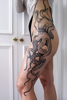 a woman's leg with an octopus tattoo on it