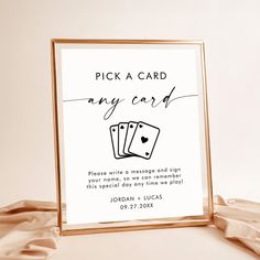 a card game is being held up in front of a white background with the words pick a card any card