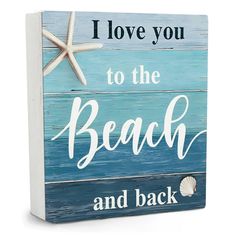 a wooden sign that says i love you to the beach and back with starfish