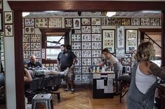 a group of people in a salon getting their haircuts done by an expert