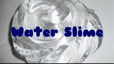 the words water slime written in blue on top of a clear glass bowl filled with water