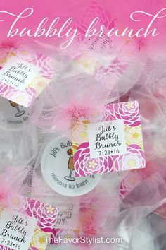 some pink and yellow tags are sitting in plastic bags with the words, bubbley brunch on them