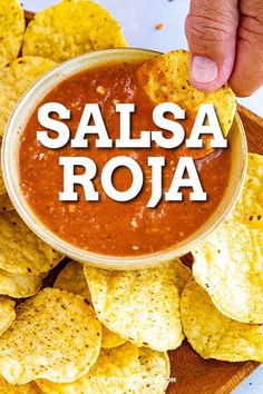 salsa roja with tortilla chips on a wooden platter and the words salsa roja above it