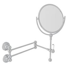 an image of a mirror on the wall with two balls attached to it's arm