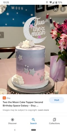 the cake is decorated with stars and moon shapes on it's top tiers