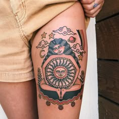 a woman with a tattoo on her thigh