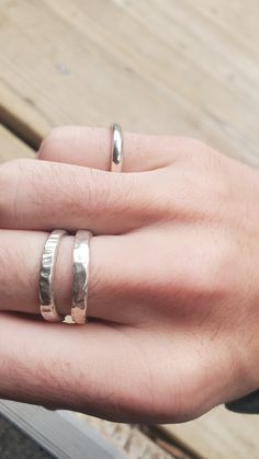 These rings are made to order and are hand fabricated. They come in 3 different styles, a plain texture, an rough hammered texture, and a grooved texture. They're made by casting sterling silver into delft clay, so sand particles and precipitate will appear in the final product. Makes each one unique ;) Delft Clay Casting, Unique Hammered Rings For Everyday Wear, Silver Hand Cast Rings For Everyday, Hand Cast Silver Rings For Everyday, Hand Cast Silver Rings For Everyday Wear, Minimalist Hand Cast Jewelry For Anniversary, Artisan Hand Cast Adjustable Ring, Adjustable Minimalist Hand Cast Rings, Minimalist Adjustable Hand Cast Rings