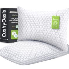 two pillows are next to each other on a white background with a green sticker