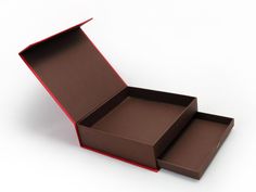 two open boxes sitting next to each other on a white surface with one opened and the other closed