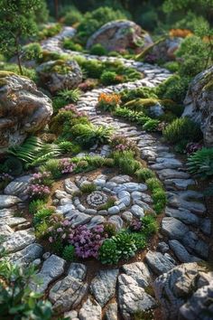 a garden with rocks, plants and flowers on the ground in front of it is an image of a stone path