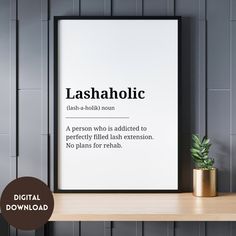 a poster with the words lasahholic on it next to a potted plant