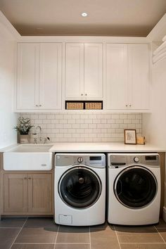 a washer and dryer sitting in a kitchen next to each other on top of a counter