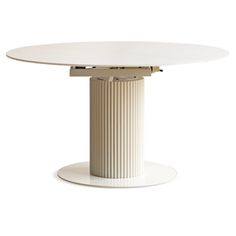 a white table with a circular top and two columns on the base, in front of a white background