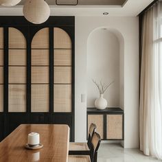 a dining room with black and white decor