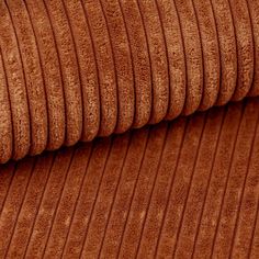 a close up view of a brown fabric with pleated lines on the top and bottom