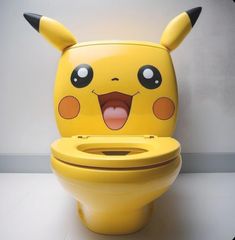 a yellow pokemon toilet with its mouth open