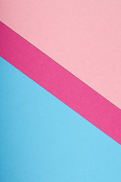 a pink and blue background with two different colored strips on top of each other in the center