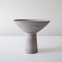 a white bowl sitting on top of a table