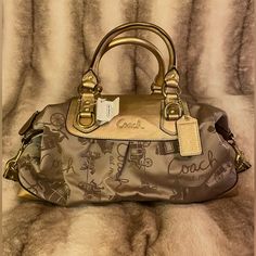 Brand New Unused. Gold Leather, Metallic Nylon Material. Coach Large Satchel Handbag. Luggage Tag Attached. Original Retail $398 New With Tags Vintage Designer Bags, Luxury Bags Collection, Girly Bags, Gold Bag, Bags Coach, Fancy Bags, Vintage Purses, Satchel Handbag, Pretty Bags