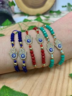 This listing is for one Crystal Beaded Rhinestone Hamsa Shambala String Bracelet. These bracelets are adjustable and can be worn on any wrist size. This bracelet is available in 3 different colors for you to choose from: Red, Teal, and Dark Blue. The Hamsa Hand is a symbol of spiritual protection. Dating back thousands of years and seen in many different cultures, the Hamsa Hand is known to protect it's user and bring good luck, health, and happiness. **Due to the unique nature of each stone, your item may vary slightly from the picture shown. All items are cleansed with white sage before being shipped. Any comments, questions, or concerns feel free to contact me, I am here to help! Handmade Adjustable Spiritual Evil Eye Bracelet, Adjustable Multicolor Crystal Bracelet With Rhinestones, Hamsa Bracelet Evil Eye, Shambala Bracelet, Bohemian Blue Evil Eye Bracelet Hand-strung, Adjustable Blue Evil Eye Bracelet Hand-strung, Bohemian Adjustable Hand-strung Evil Eye Bracelet, Clay Birds, Hand Bracelet