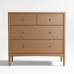 the chest of drawers is made from wood and has four drawers, one with two handles