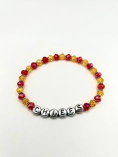 This fun and beautiful CHIEFS inspired Silver letter bracelet is handmade with 6mm Red & Yellow high quality Faceted Crystal Glass Rondelle Briolette beads with Silver accent spacer beads. For all ages as the beads are very high quality and shimmer when the light catches them! Perfect for a stocking stuffer gift!  Last pic shows how to measure your wrist, please do so as there are no exchanges for different sizes. Free shipping for orders over $35! Please checkout my other bracelets! 💞  #kansascity #chiefs #football #stockingstuffers Letter Bead Bracelets, Chiefs Football, Letter Bracelet, Bracelet Diy, Stocking Stuffer Gifts, Letter Beads, Faceted Crystal, Silver Accents, Stocking Stuffer