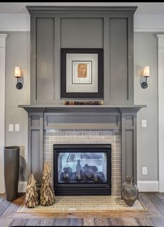 a living room with a fire place next to a painting on the wall above it