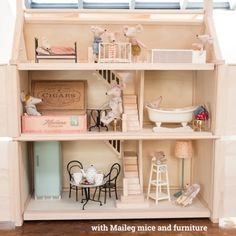 a doll house with furniture and accessories in it