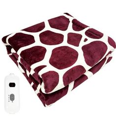 a blanket and remote control on a white background