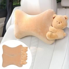 a teddy bear laying on the back seat of a car next to a stuffed animal