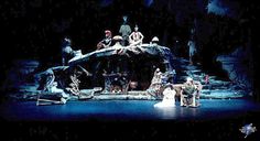 an image of a stage scene with people on the stage and one man in costume