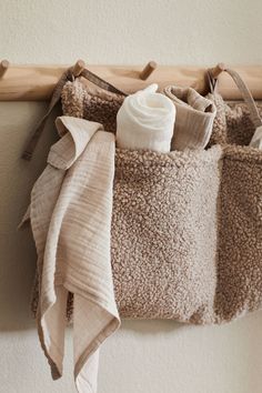 towels hanging on a towel rack in a bathroom