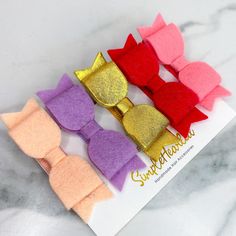 5 Tiny Felt Bow Hair Clips These felt bows are a classic hair accessory. Each bow is 2.5 inches, and is handcrafted from a soft Merino Wool blend felt.  This listing includes all 5 mini felt bows shown, they are securely attached to a partially lined alligator clip.  ♥ Merino Wool is the Softest, Strongest, and Warmest Wool on the planet. This wool blend felt is more dense and durable, and it's less likely to pill, pull apart or fray. That is why we chose it for our Felt Bow line. The wool is imported and the Felt is MADE IN THE USA.    SimpleHearted    ♥ All items are handmade in the USA. ♥ Items are packaged on an accessory card with our logo, perfect for gifting! ♥ Check our shop policies page for shipping times and all additional info. ♥ Get Social ... Follow us on Instagram @SimpleHea Felt Hair Bows, Tiny Hair, Hair Bow Clips, Classic Hair, Felt Bows, Toddler Hair Clips, Palm Bay, Baby Bow, Handmade Hair Accessories