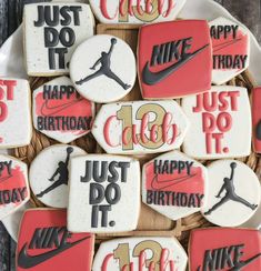 cookies decorated with nike and just do it on a plate