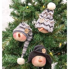 three christmas ornaments hanging from a tree with snowflakes and hats on it's heads