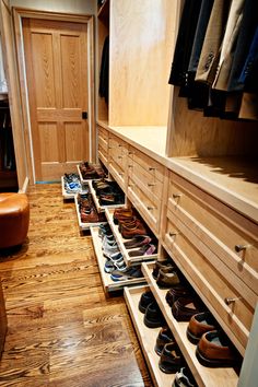 an organized closet with shoes on the shelves