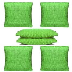 four lime green pillows and two pillow covers