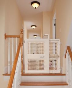 the dog gate is on the stairs in the house