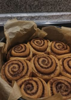 there are many cinnamon rolls in the pan